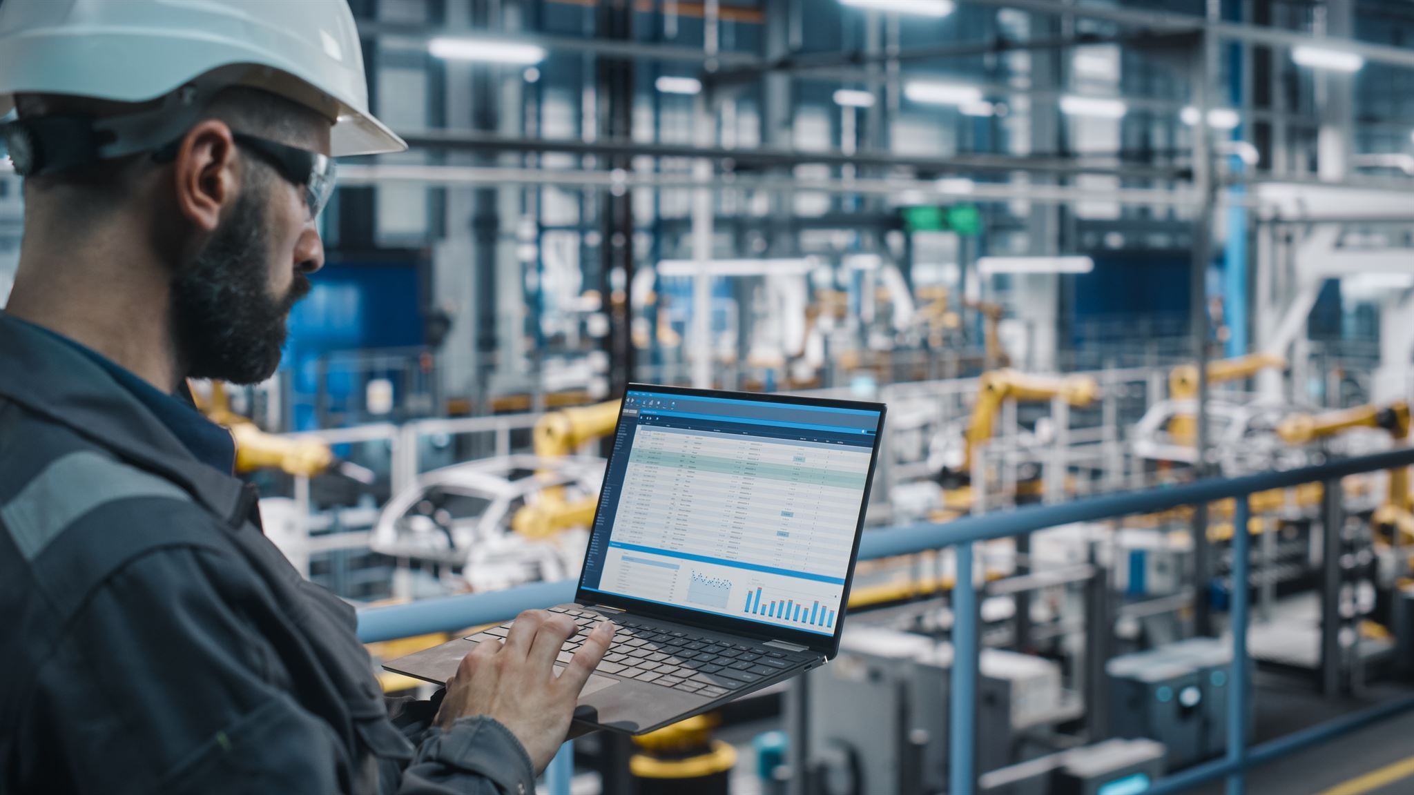 Man-with-laptop-in-factory
